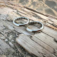 two grace rings on drift wood