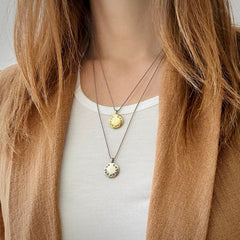layered necklaces one silver one gold coin 
